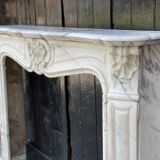Louis XV style fireplace in white Carrara marble arabescato