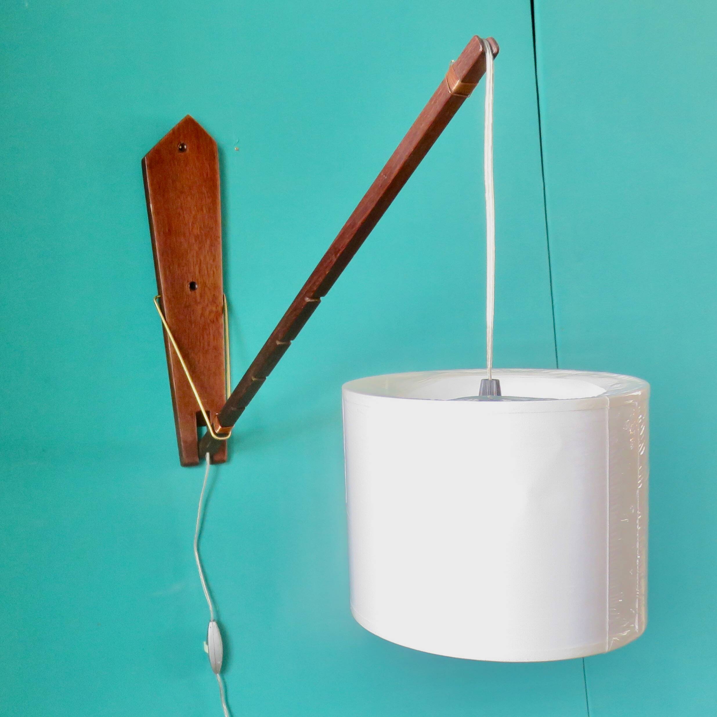 Teak wall light with articulated arm. Denmark 1960