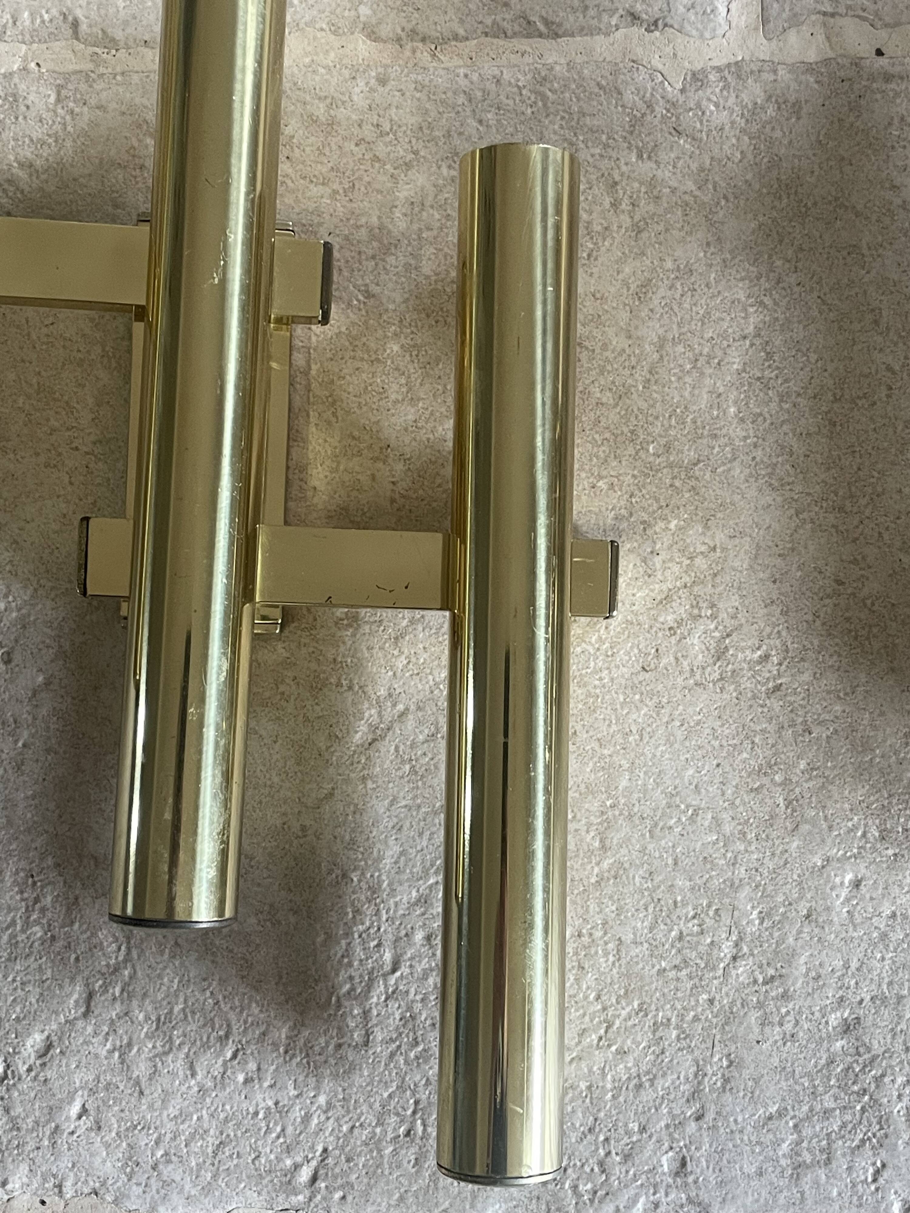 Tubular wall sconces in brass, Italian design from the 1970s, attributed.