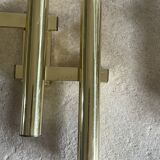 Tubular wall sconces in brass, Italian design from the 1970s, attributed.