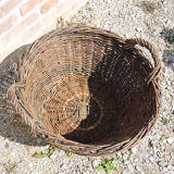 Old round wicker linen basket, dark rattan