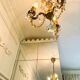 Small vintage brass chandelier with amber crystal pendants.