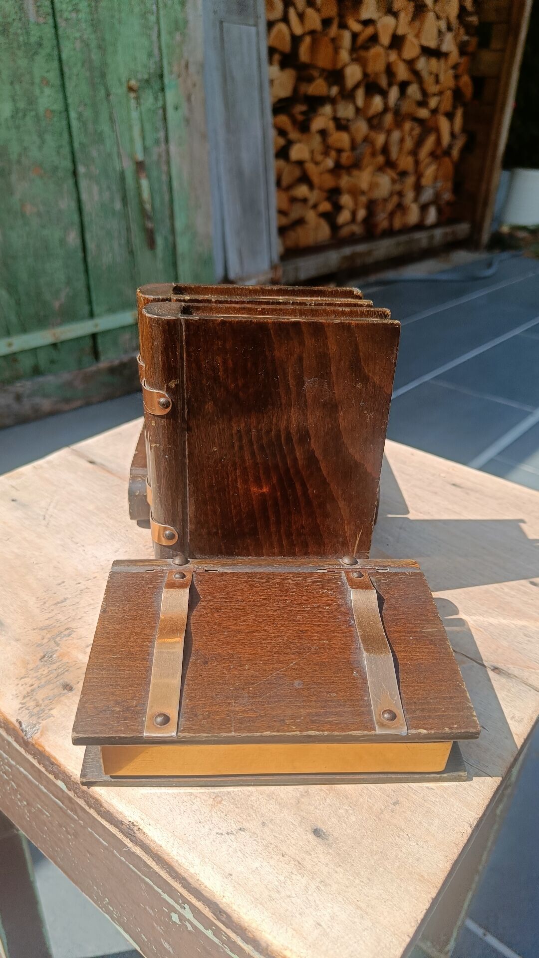 Wooden trompe-l'œil bookends with a book and box