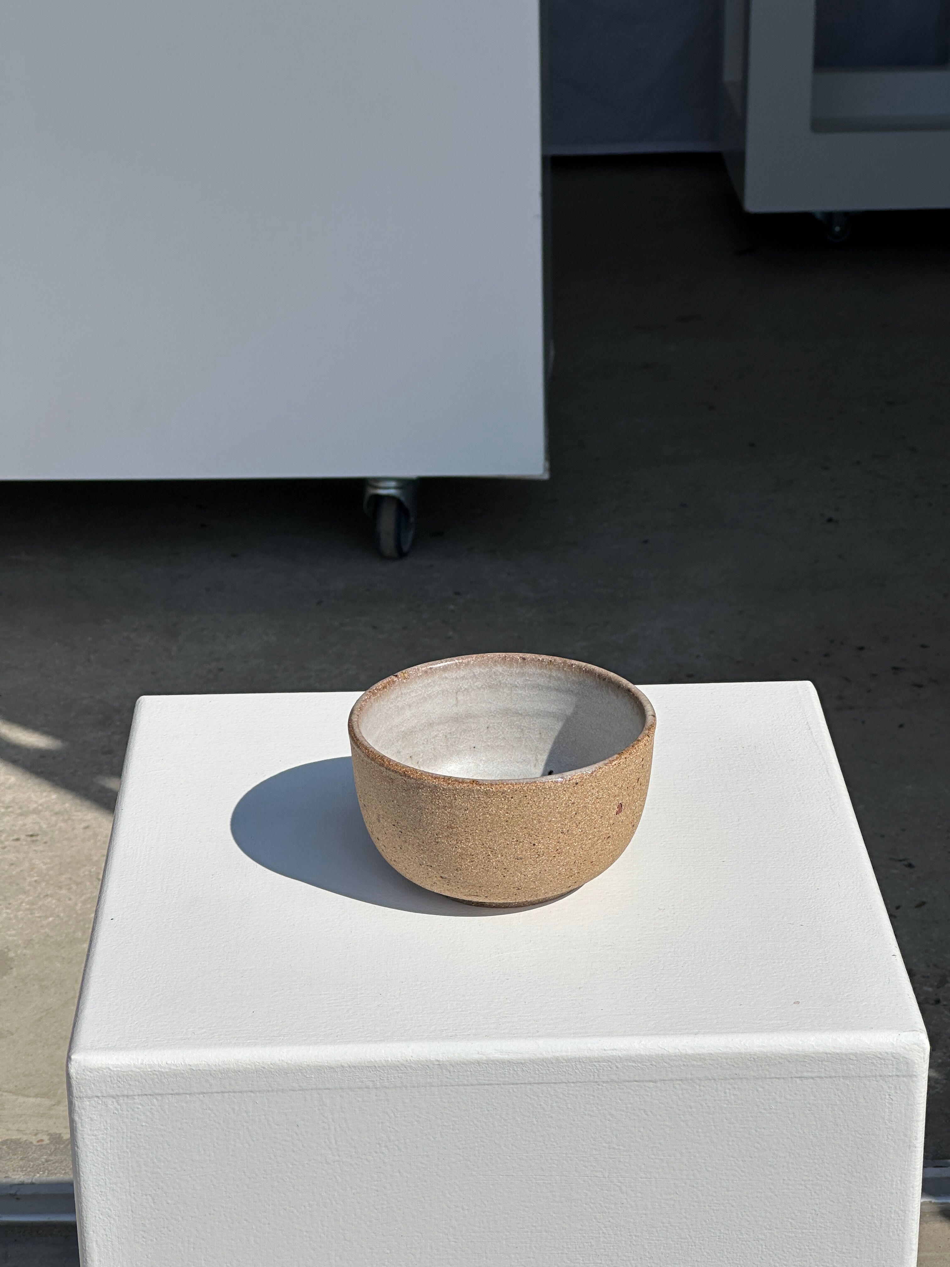 Small brown bowl inside blue and white