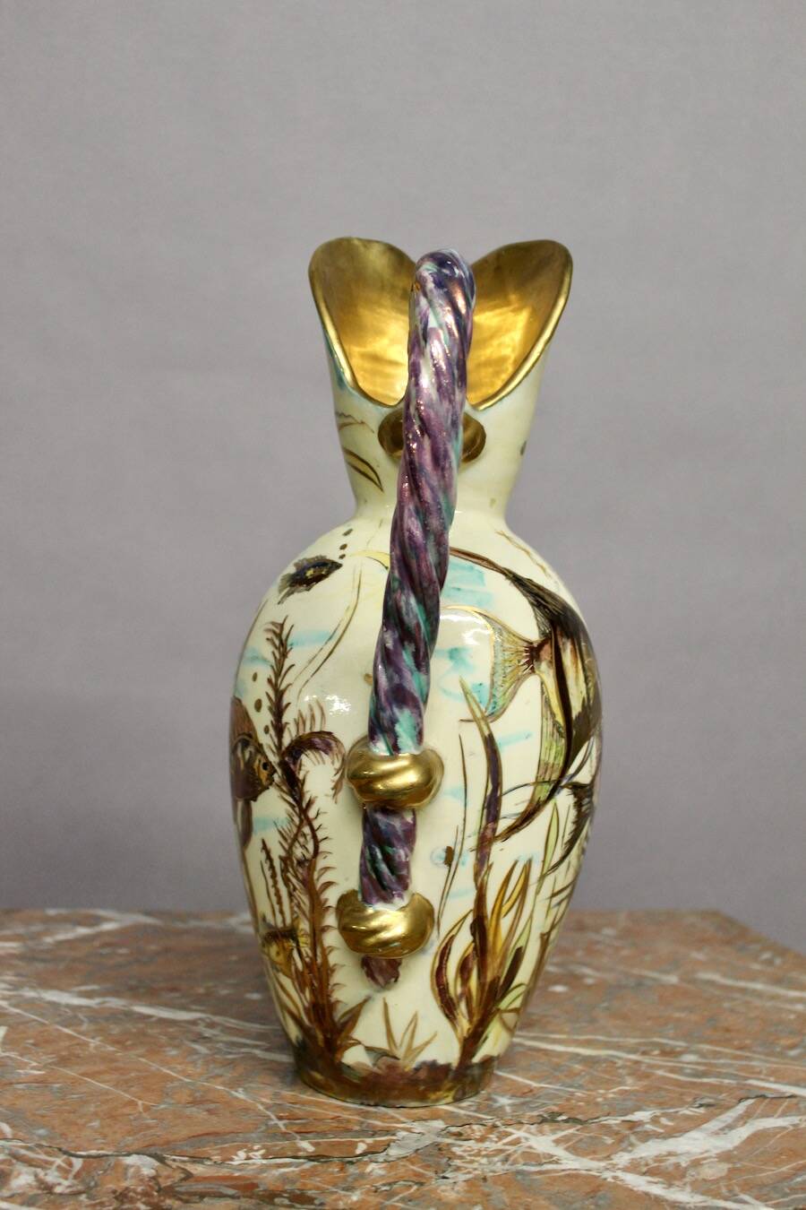 Ceramic jug with fish decoration