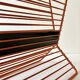 Wire metal magazine rack with triangular compartment, 1950s.