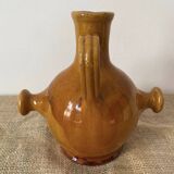 Provençal jug in orange/caramel glazed earthenware