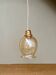 Suspension tulipe vintage en verre ambré