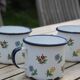 Enamelled sheet metal cups