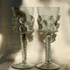 pair of blown wine glasses - green