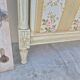 Louis XVI style bed richly decorated in patinated wood.