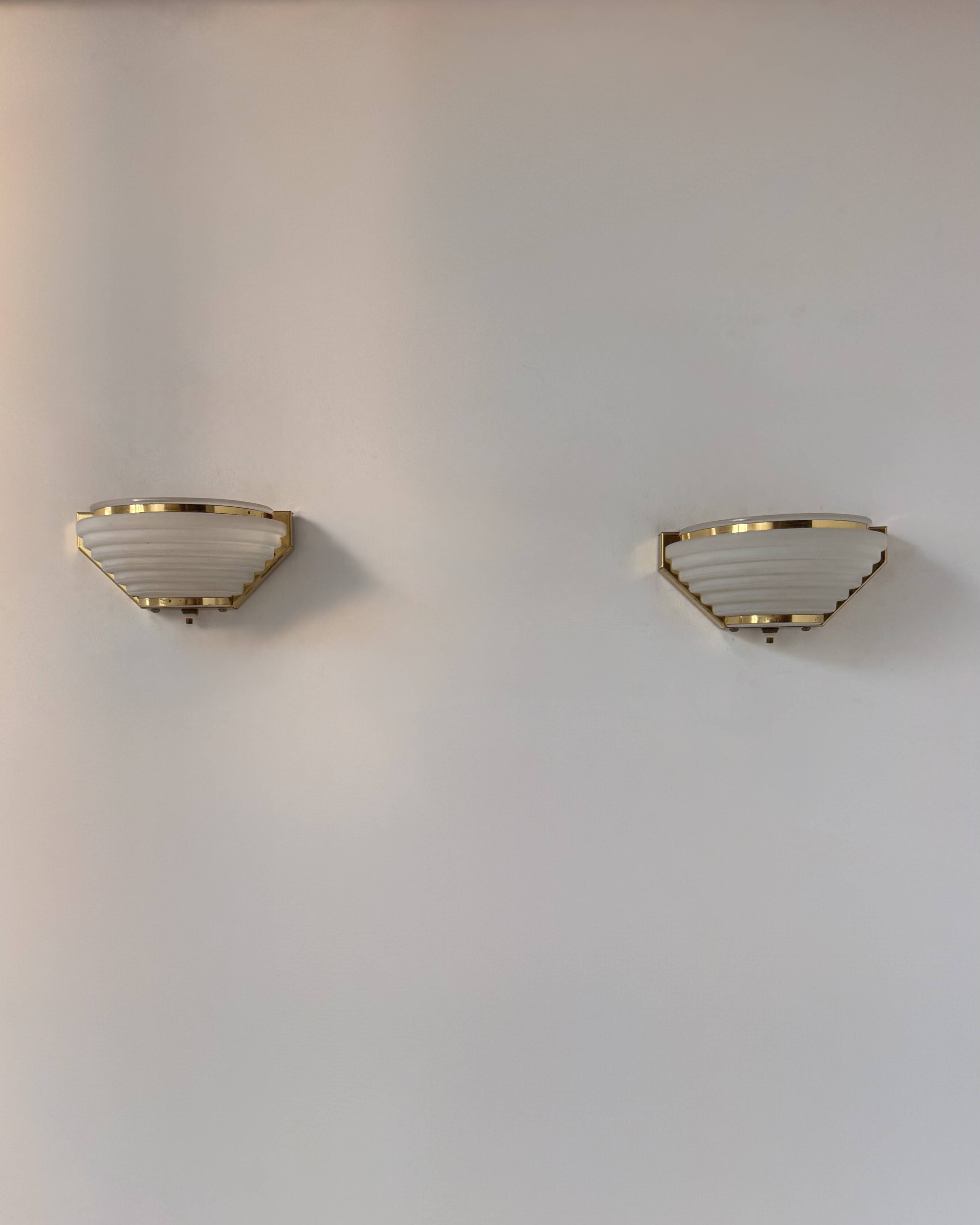 Pair of vintage brass and frosted glass wall lights, France, 1970.