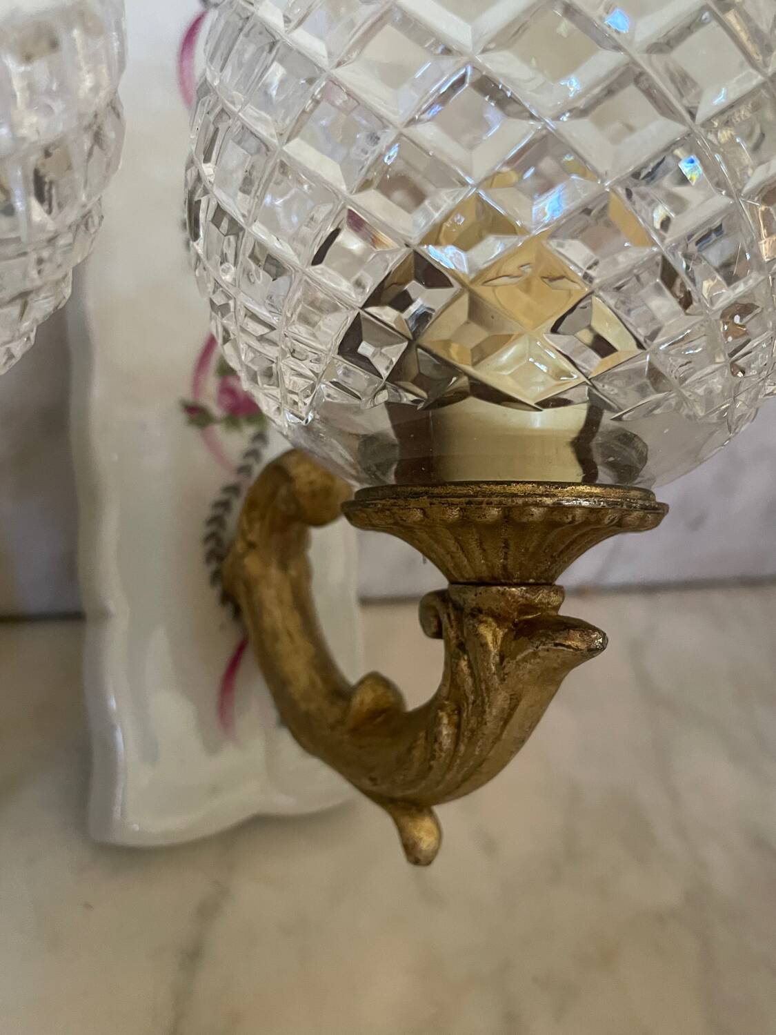 Pair of cut glass and Limoges porcelain wall sconces