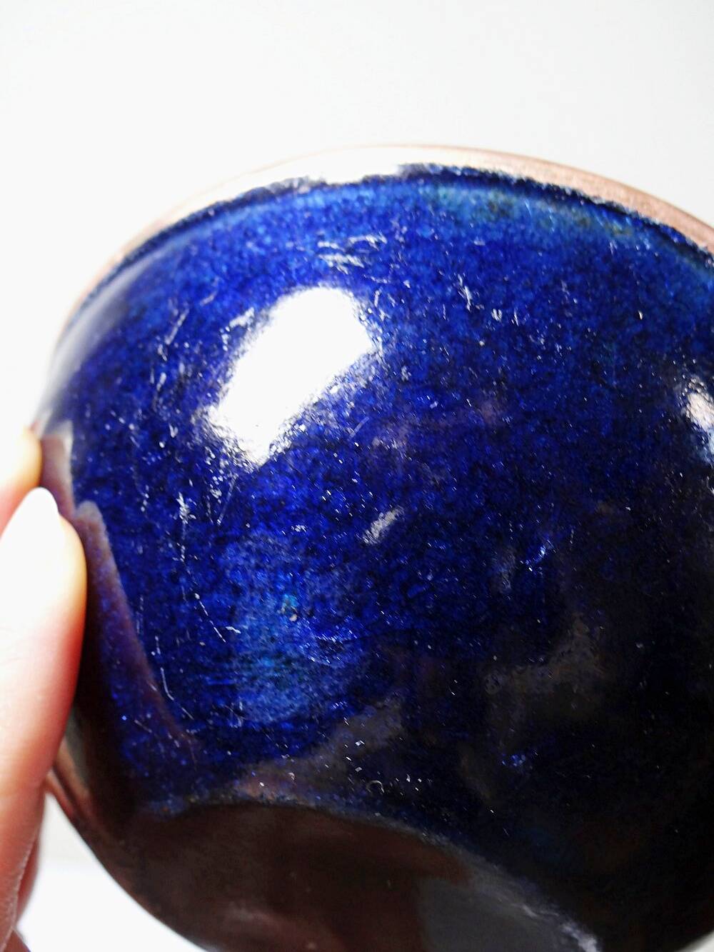 Pair of vintage hand-crafted blue and copper enamelled bowls.