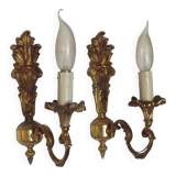 Pair of simple vintage French wall sconces in Art Nouveau bronze with leaf-shaped details.