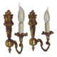 Pair of simple vintage French wall sconces in Art Nouveau bronze with leaf-shaped details.