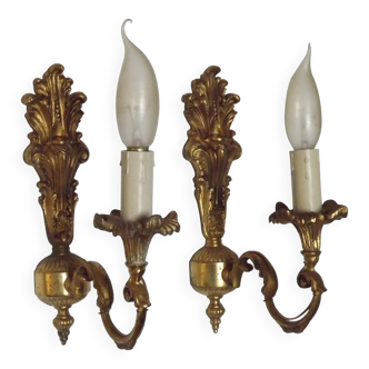 Pair of simple vintage French wall sconces in Art Nouveau bronze with leaf-shaped details.