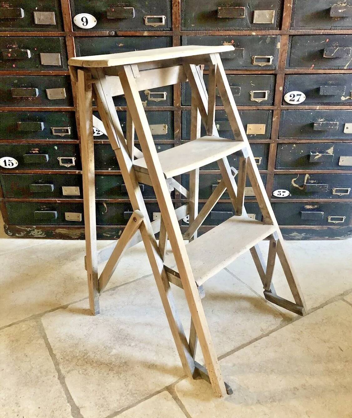 Old small painter's stepladder, wooden trade furniture, step stool