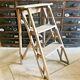 Old small painter's stepladder, wooden trade furniture, step stool