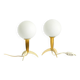 Two Mid-Century Modern rocket table lamps in brass and glass