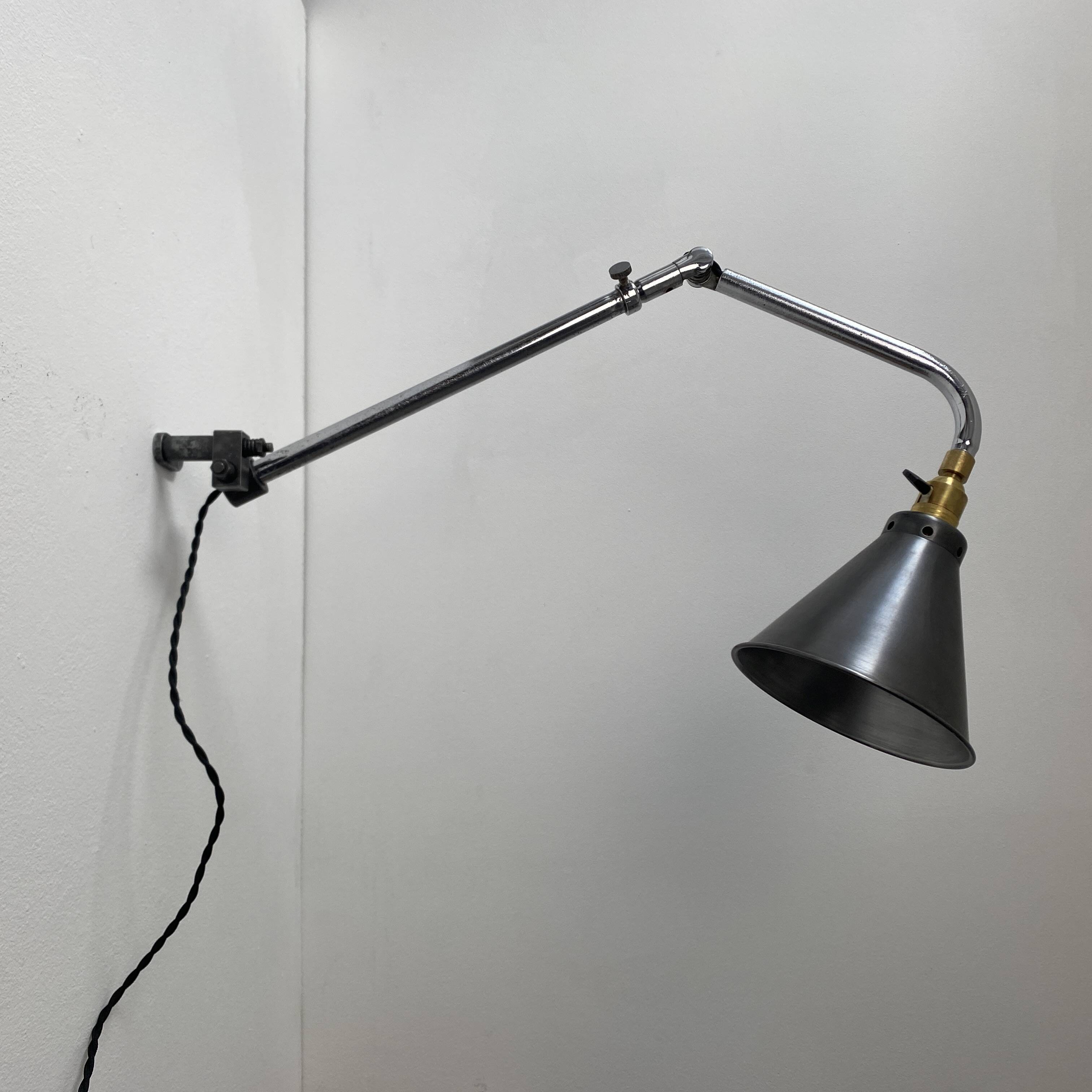 Old industrial wall light that is vintage.