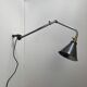 Old industrial wall light that is vintage.