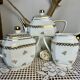 Three-piece tea or coffee service in Limoges porcelain by Singer, years.