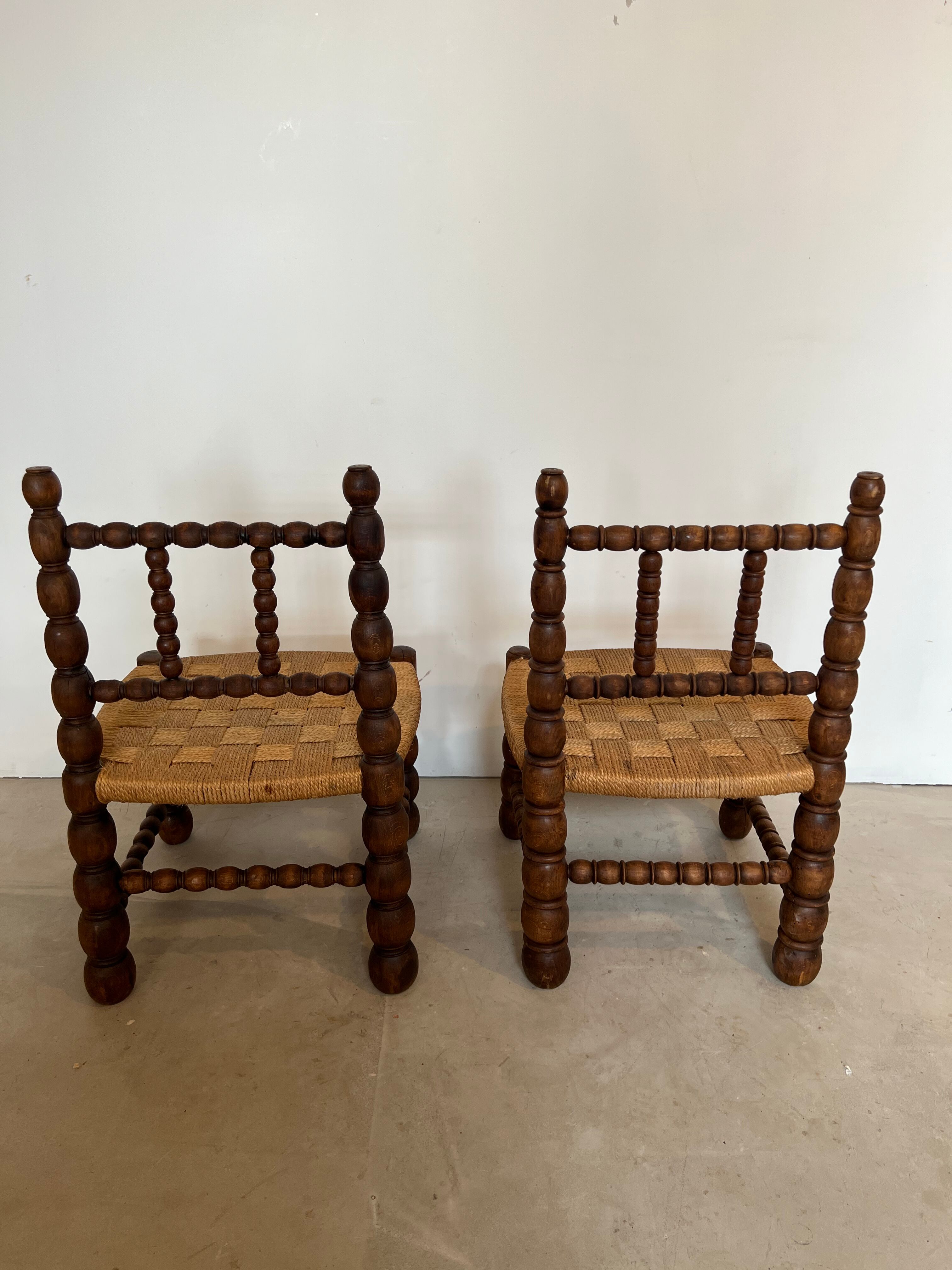 Pair of low chairs in turned wood