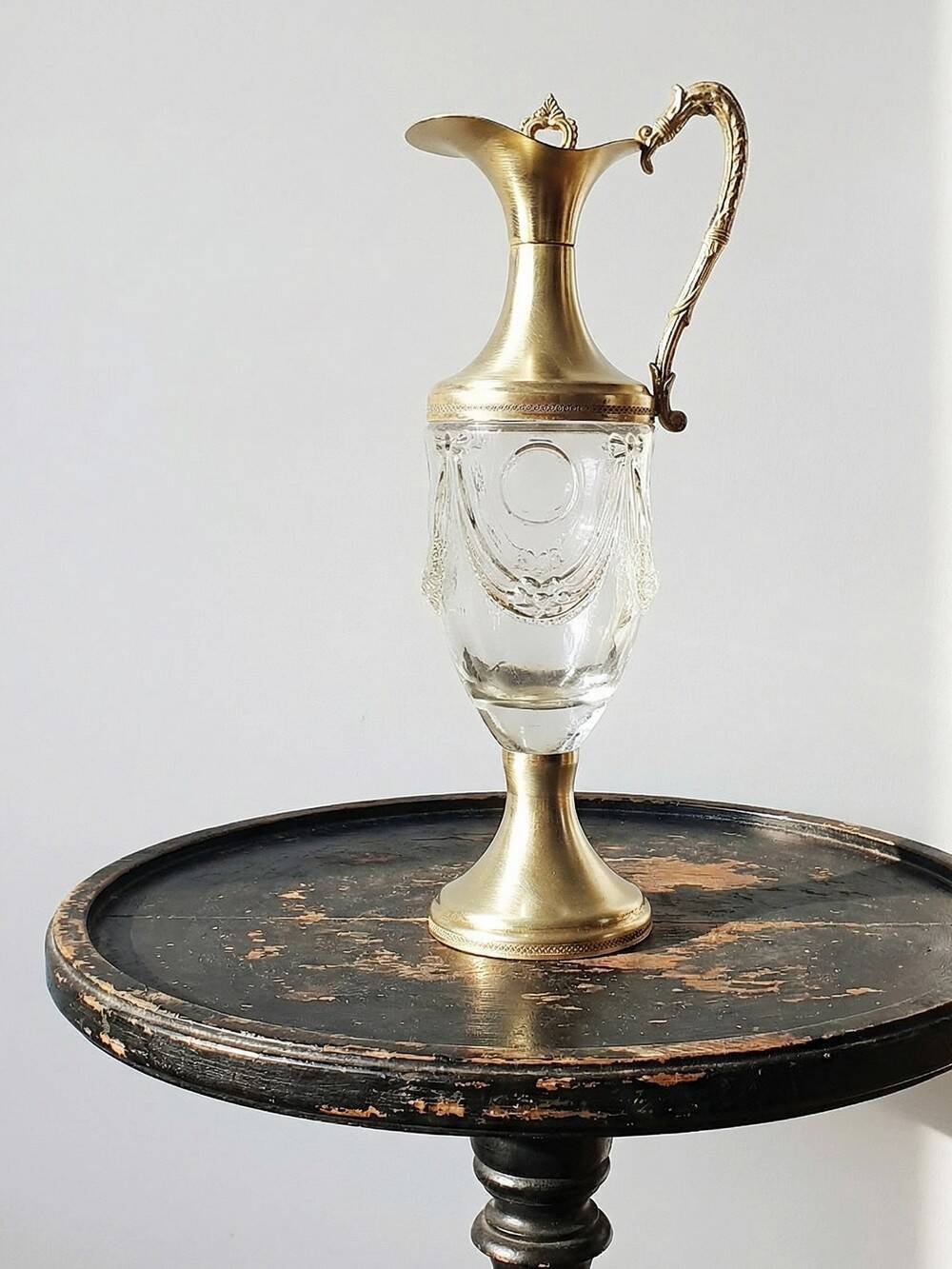 Vintage decorative jug in moulded glass and gilded brass, Italy circa 1980.