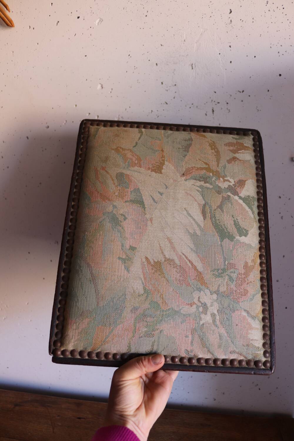 Small antique wooden and fabric footrest.