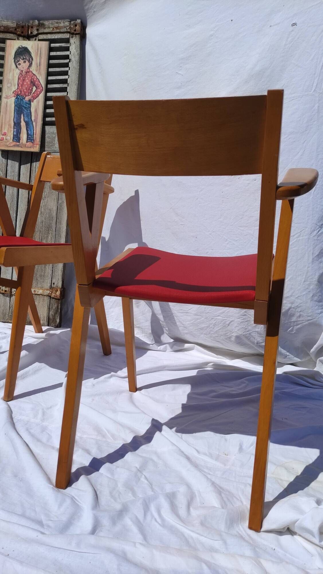 Pair of wooden armchairs and skaï foot compass of the 50s