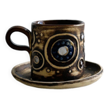 Signed ceramic mug.