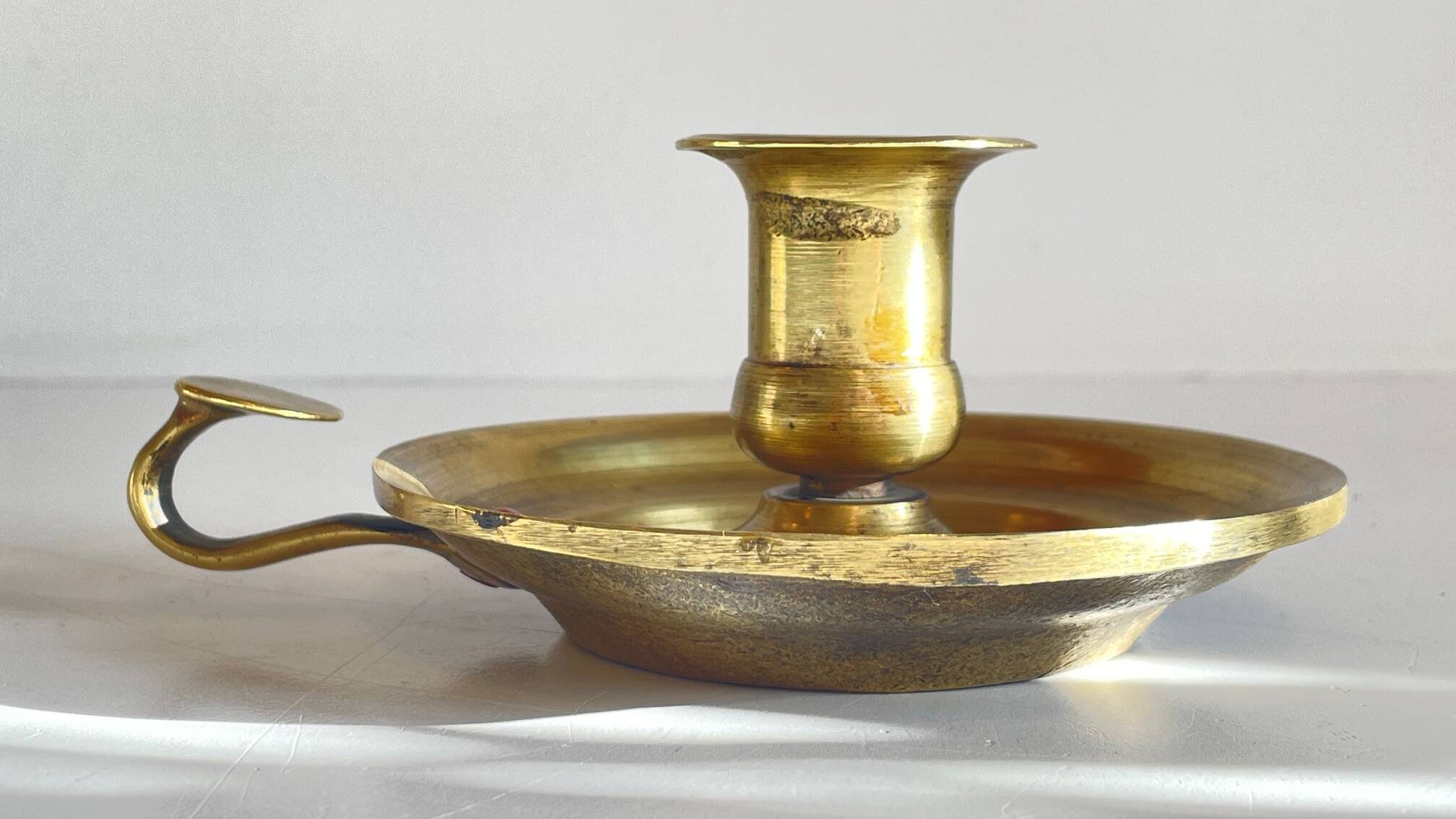 Antique solid bronze hand candlestick