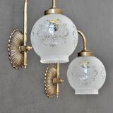 Pair of engraved glass wall lamps, brass support