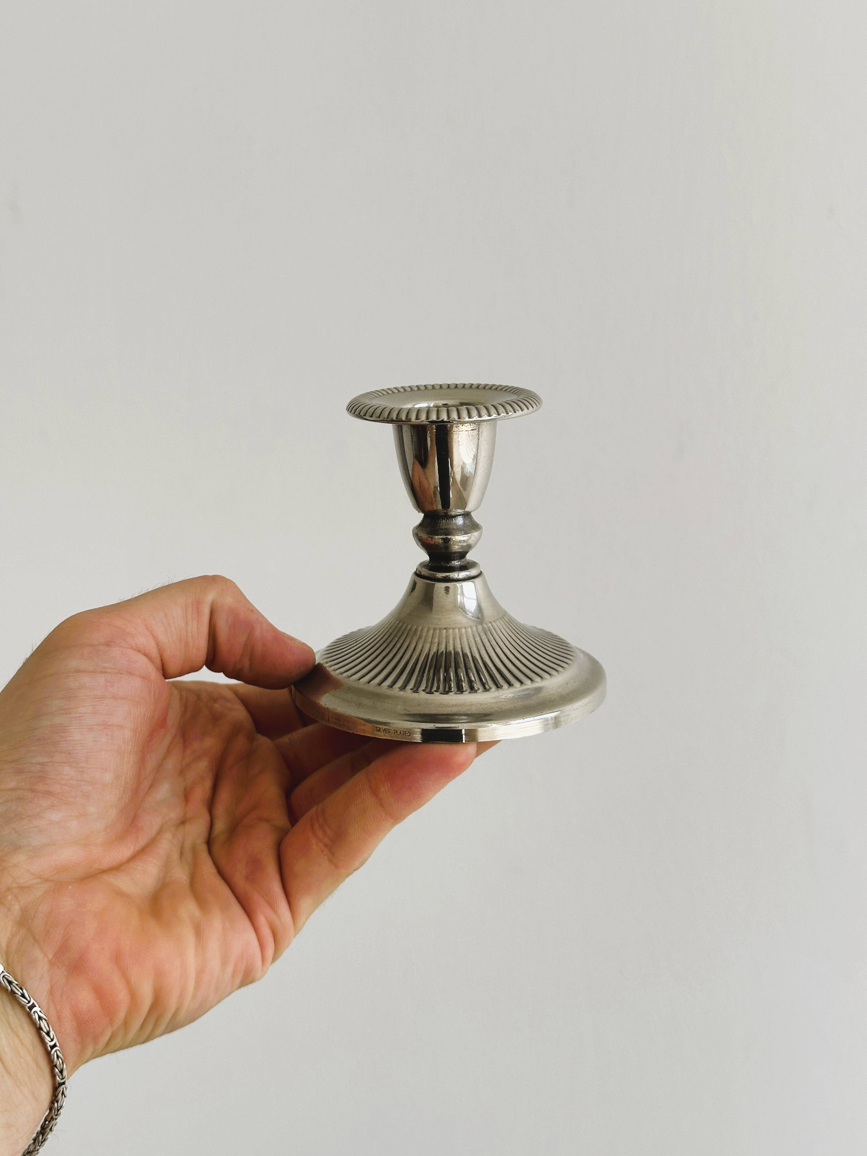 Antique patinated metal candle holder