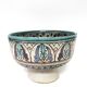 Cup on a ceramic pedestal – blue and turquoise geometric design.