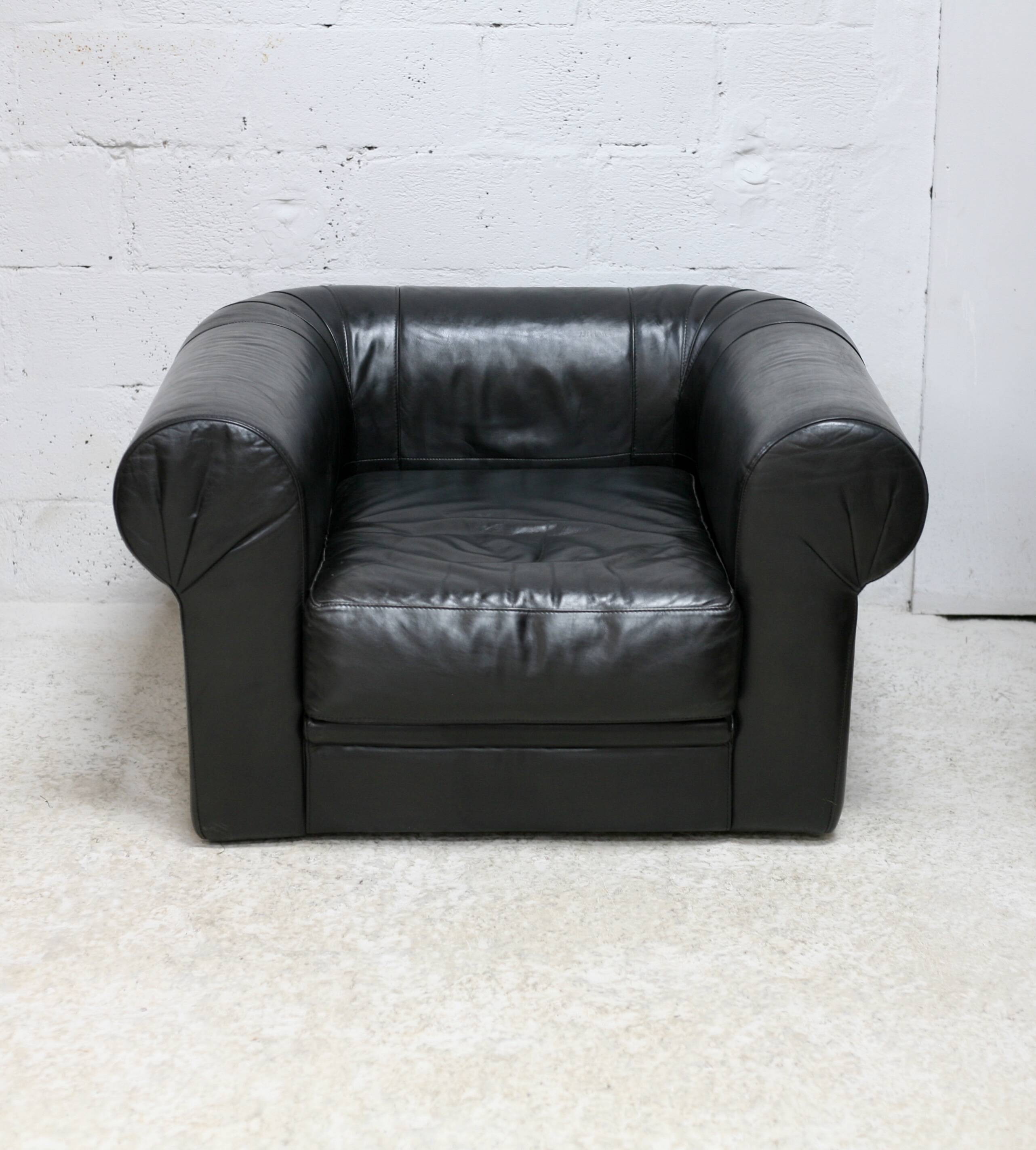 Large black leather armchair, France, 1980s