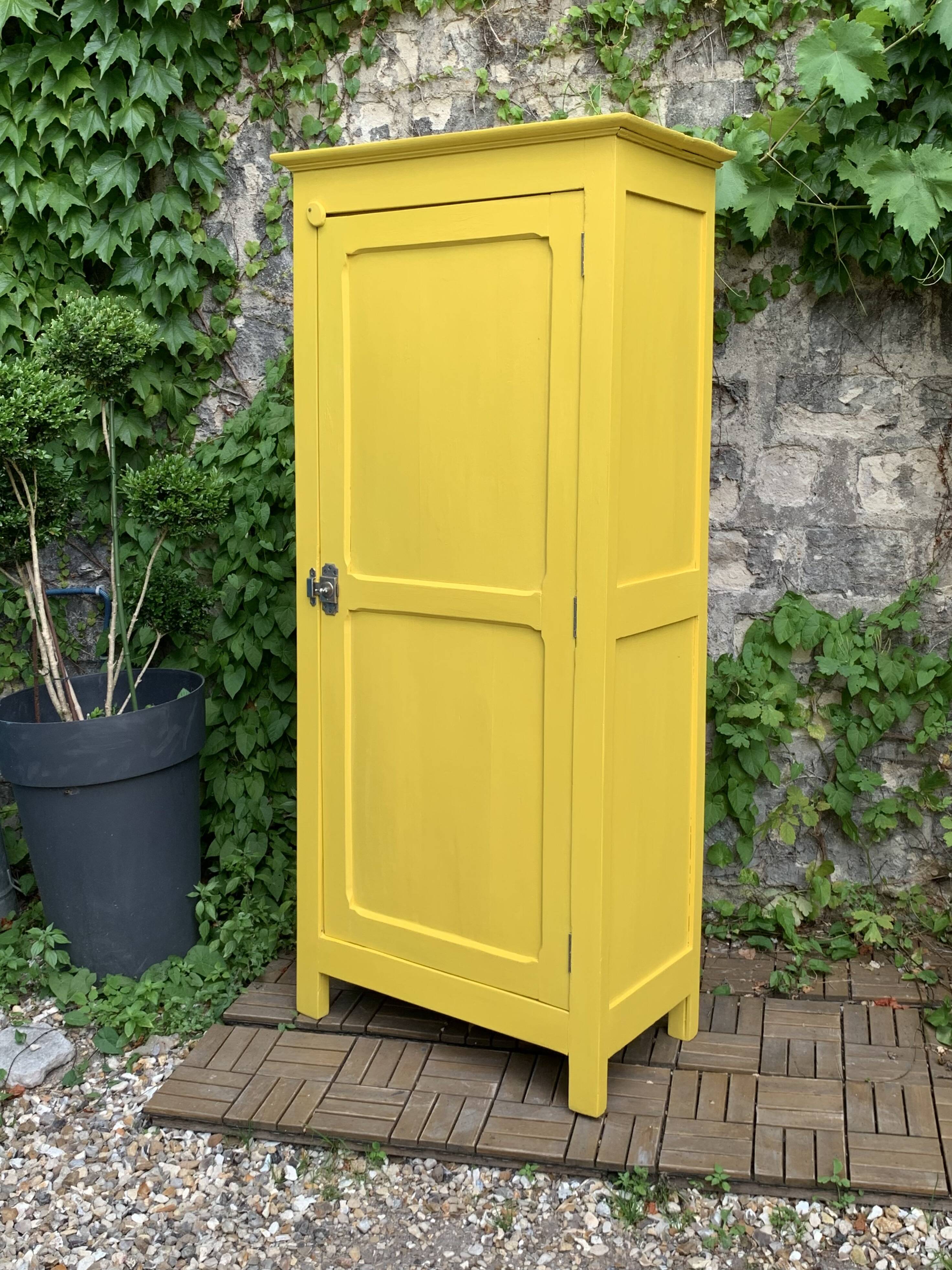 Antique powder yellow Parisian bonnetière wardrobe.