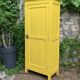 Antique powder yellow Parisian bonnetière wardrobe.