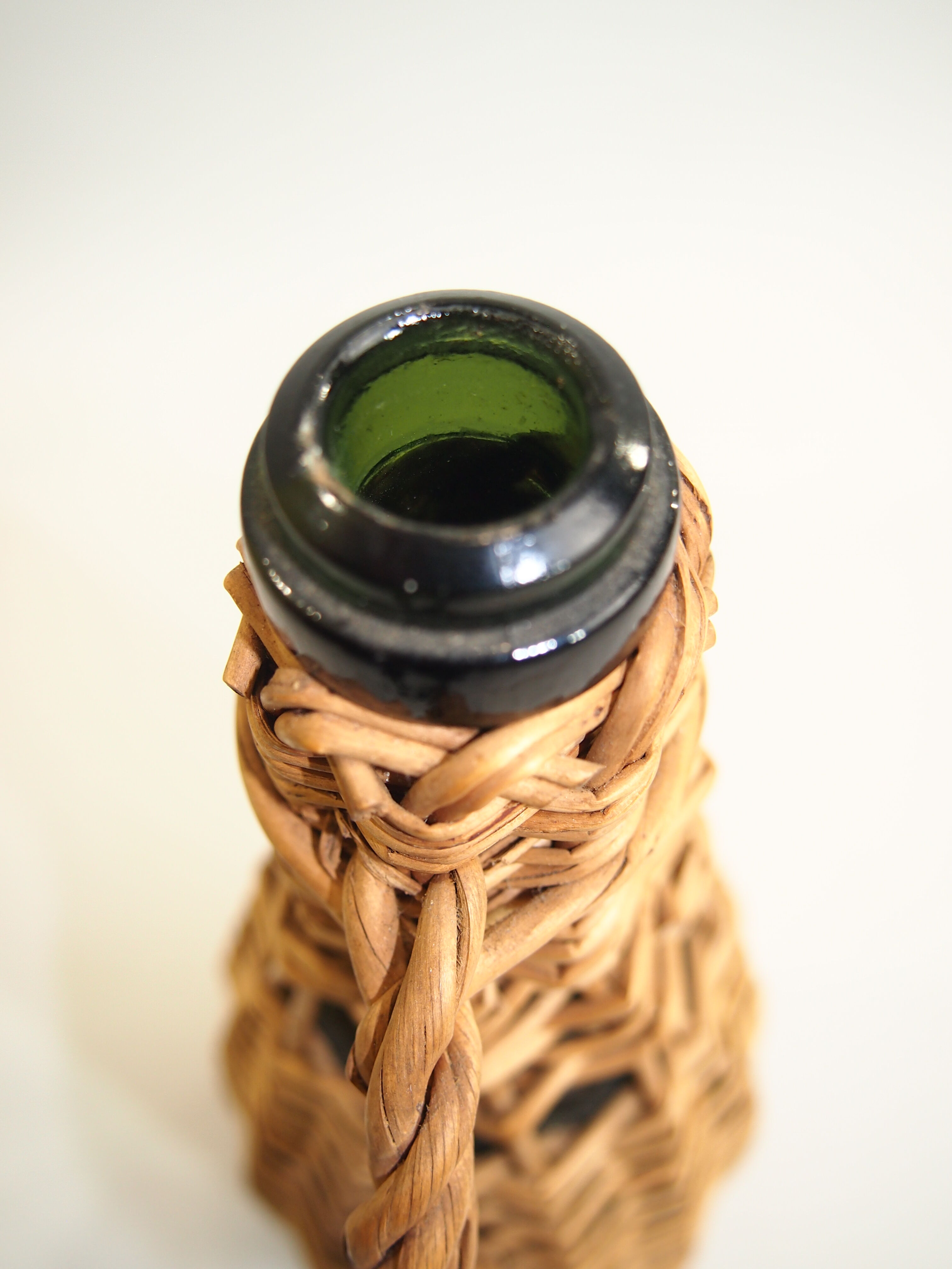 Bottle dressed in rattan