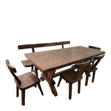 Set table, 4 chairs and a brutalist bench in the Regain style.