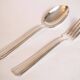 Silver plated metal service: 12 soup spoons, 12 forks and ladle.