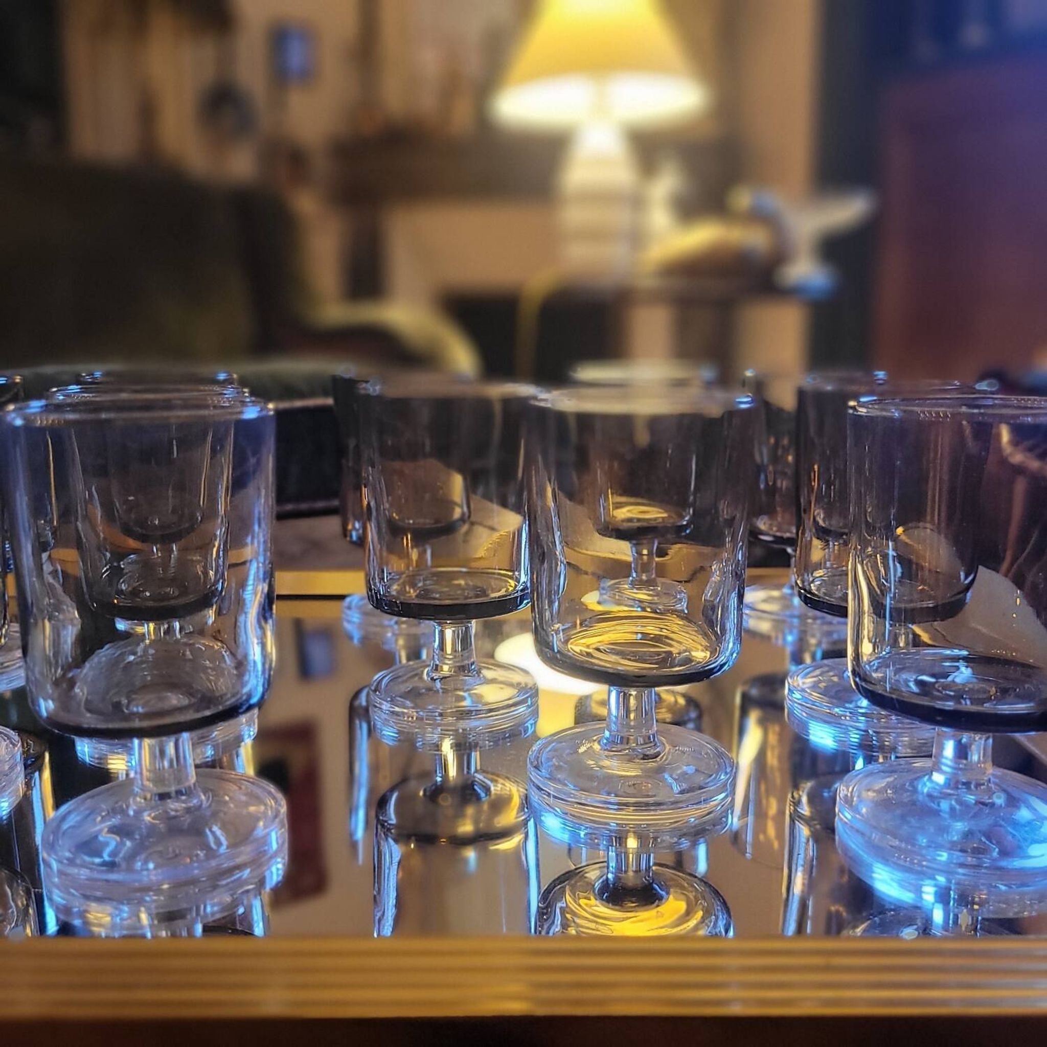 12 smoked glass stemmed glasses from the 70s and 80s.