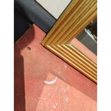 Wooden mirror and gold trim