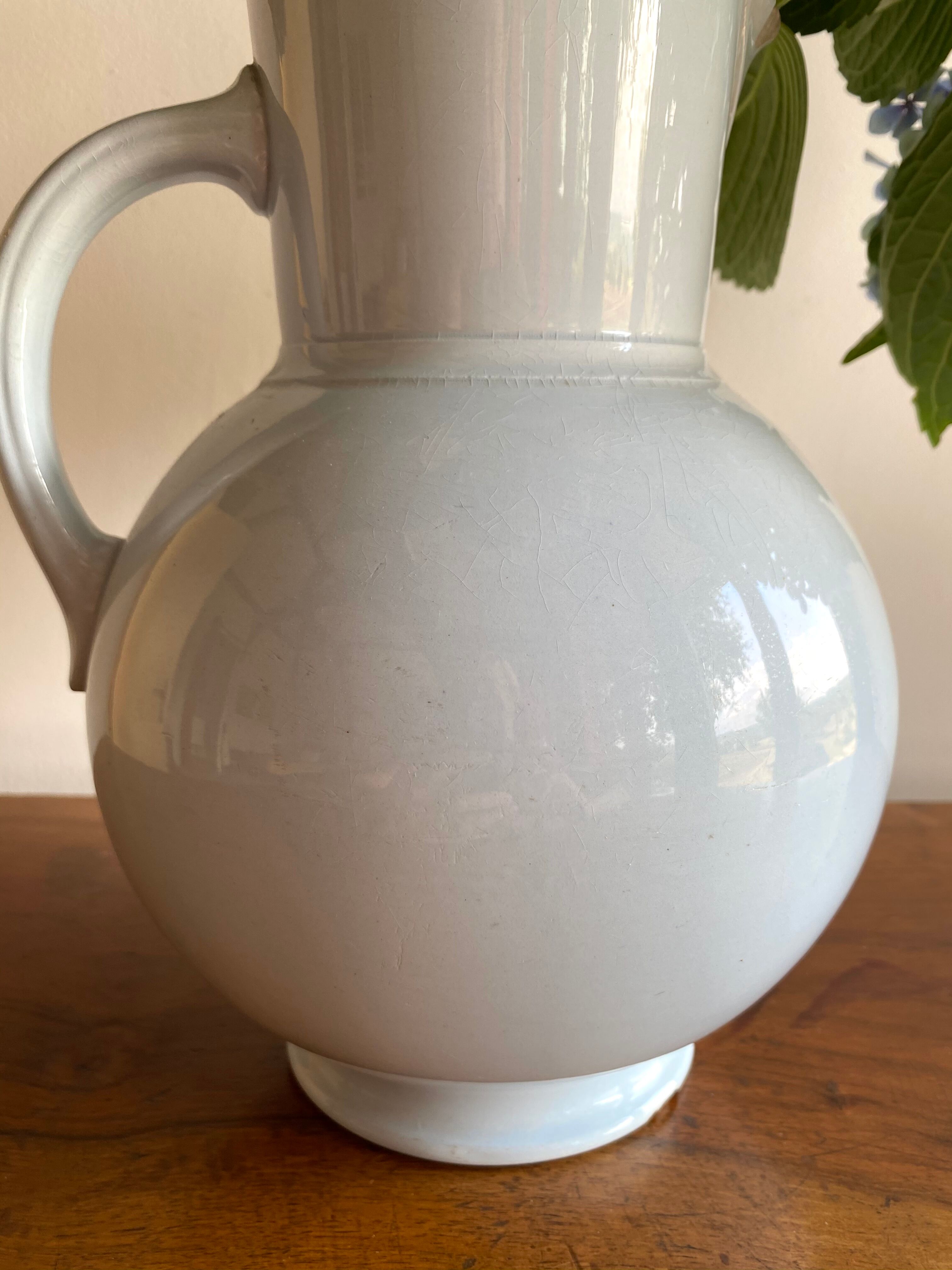 Antique vase in pale blue ceramic
