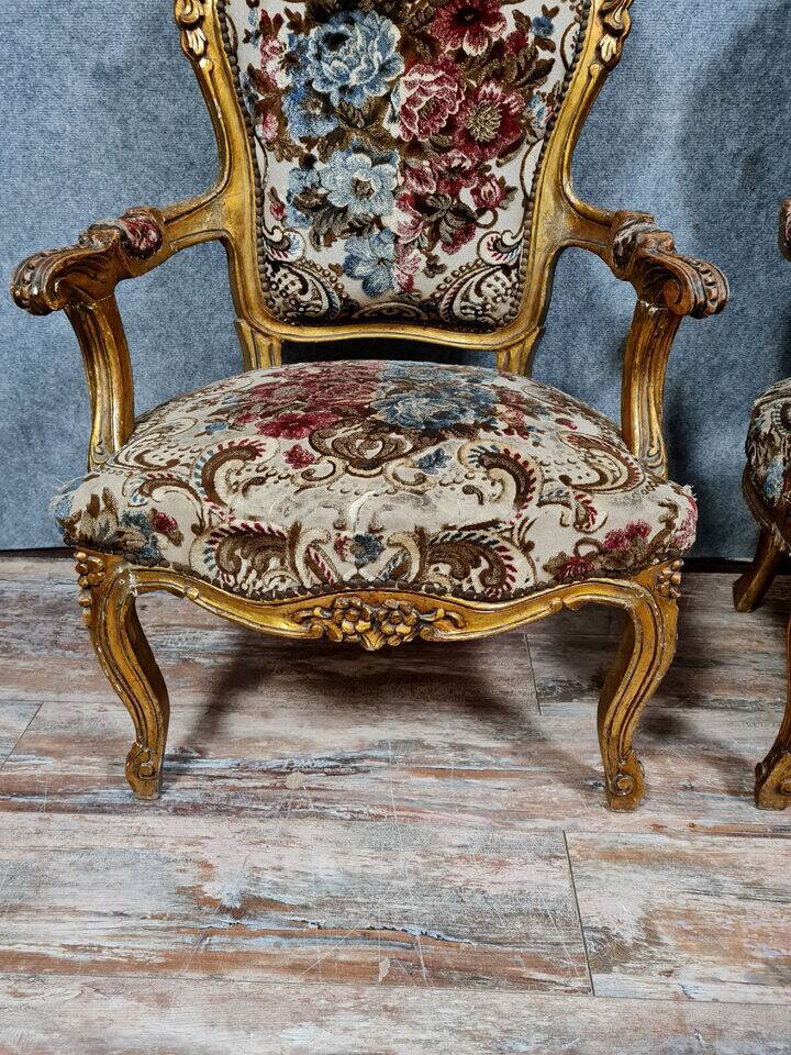 Pair of Louis XV style Baroque armchairs in gilded and carved wood circa 1900