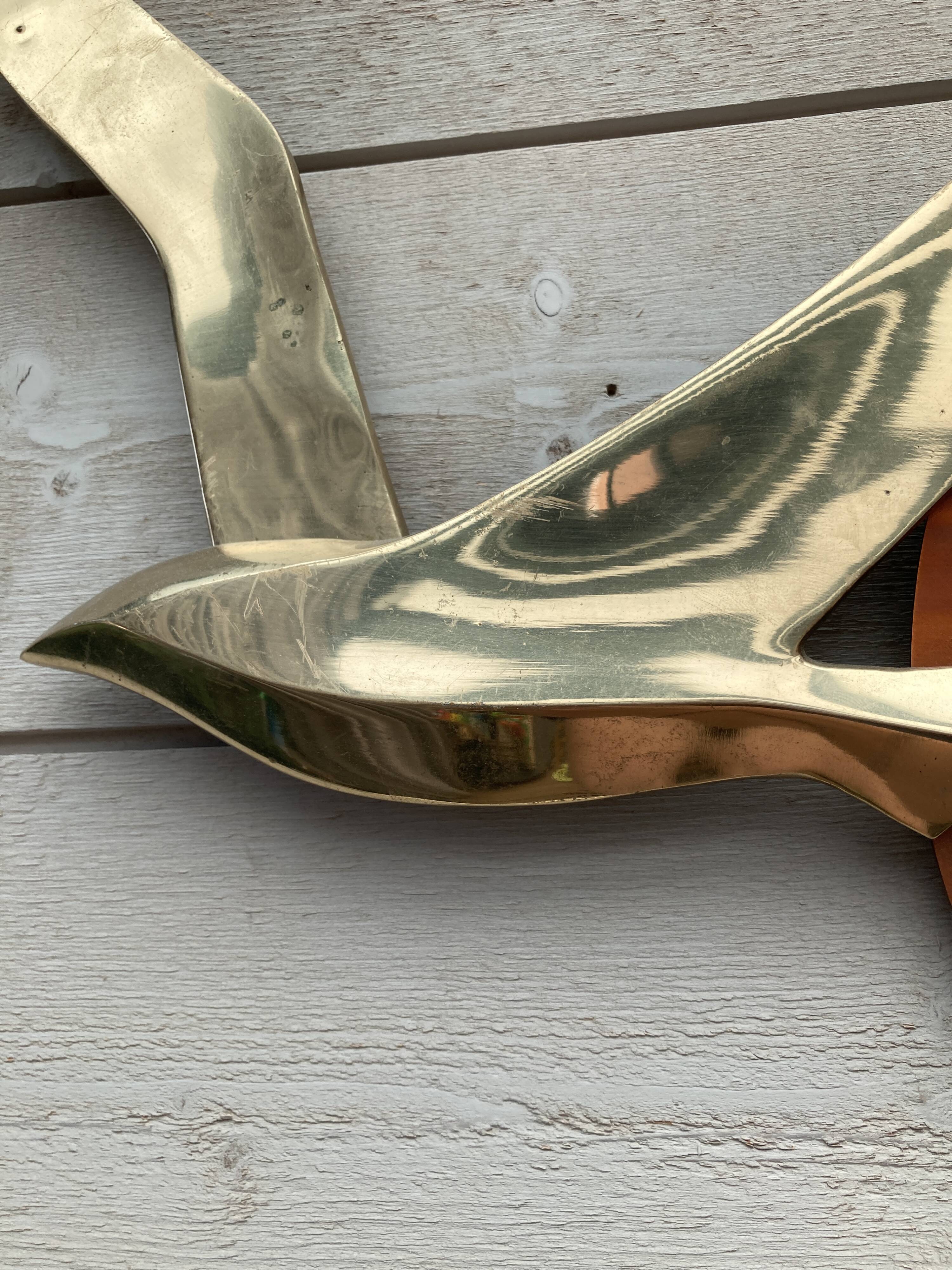 Bird brass and sun bronze wall decoration