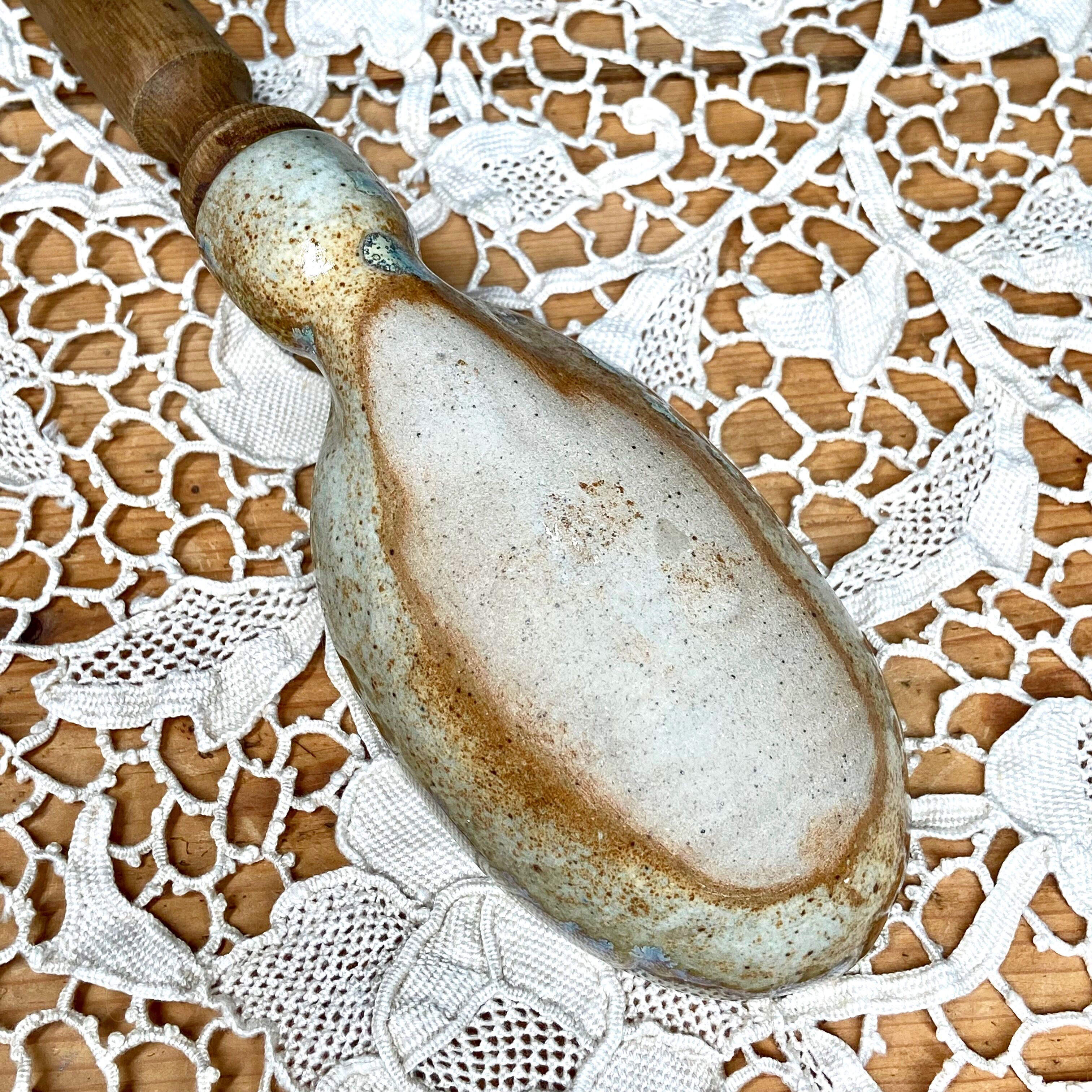 Wooden spoon and sandstone