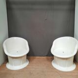 Pair of white plastic armchairs