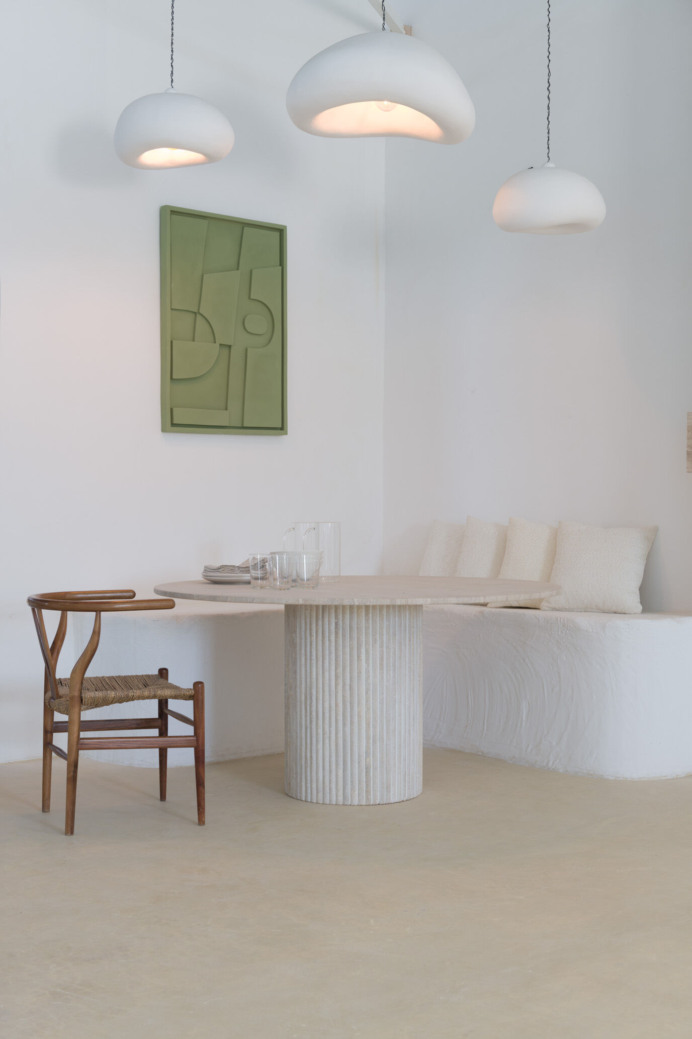 Omega circular dining table in natural travertine